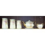 A set of three Fieldings Crown Devon Dora decorated graduated jugs and a three-piece tea service