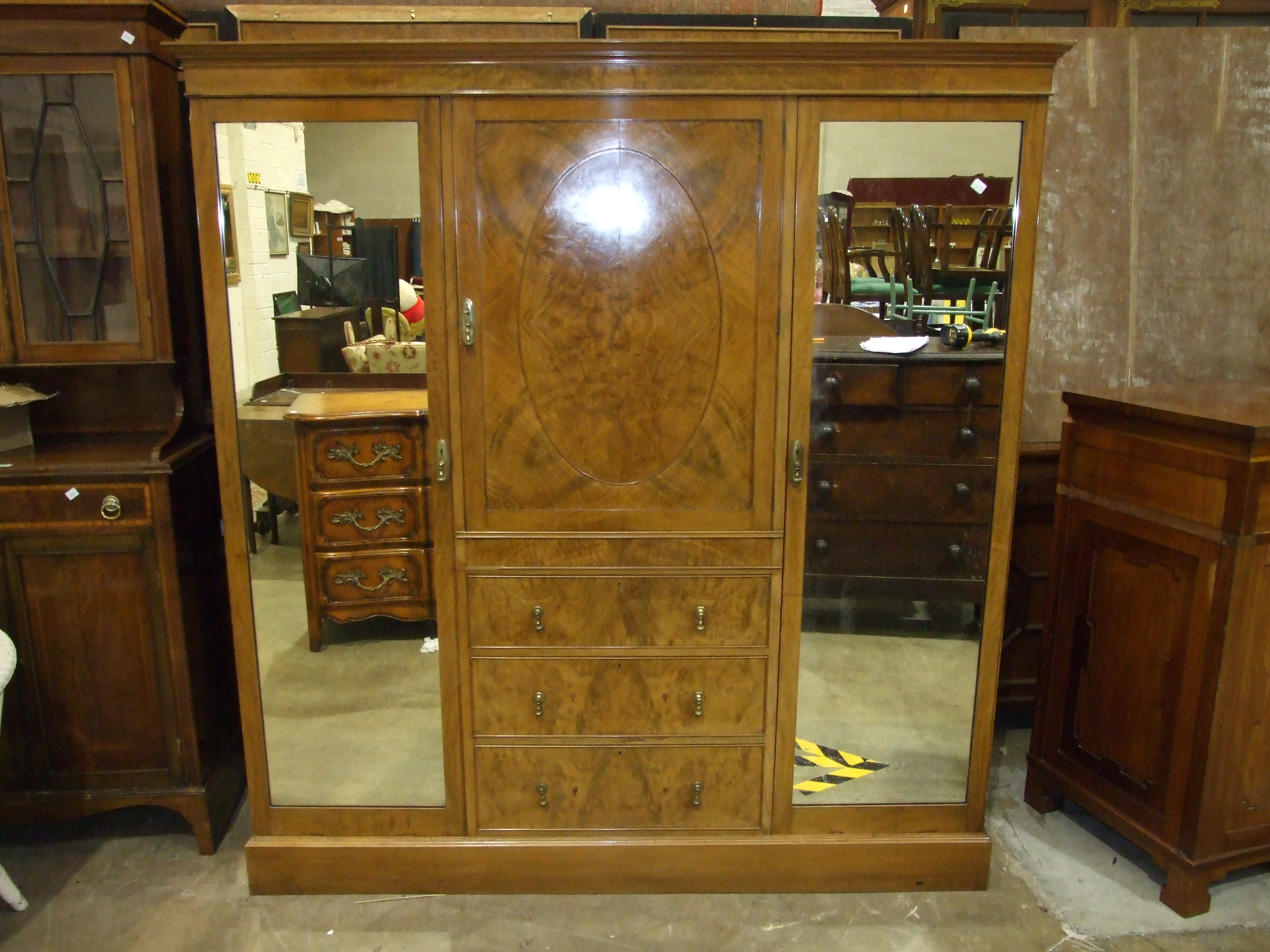 A Heal & Son Ltd walnut sectional wardrobe with central shelves and drawers flanked by mirrored - Image 2 of 4