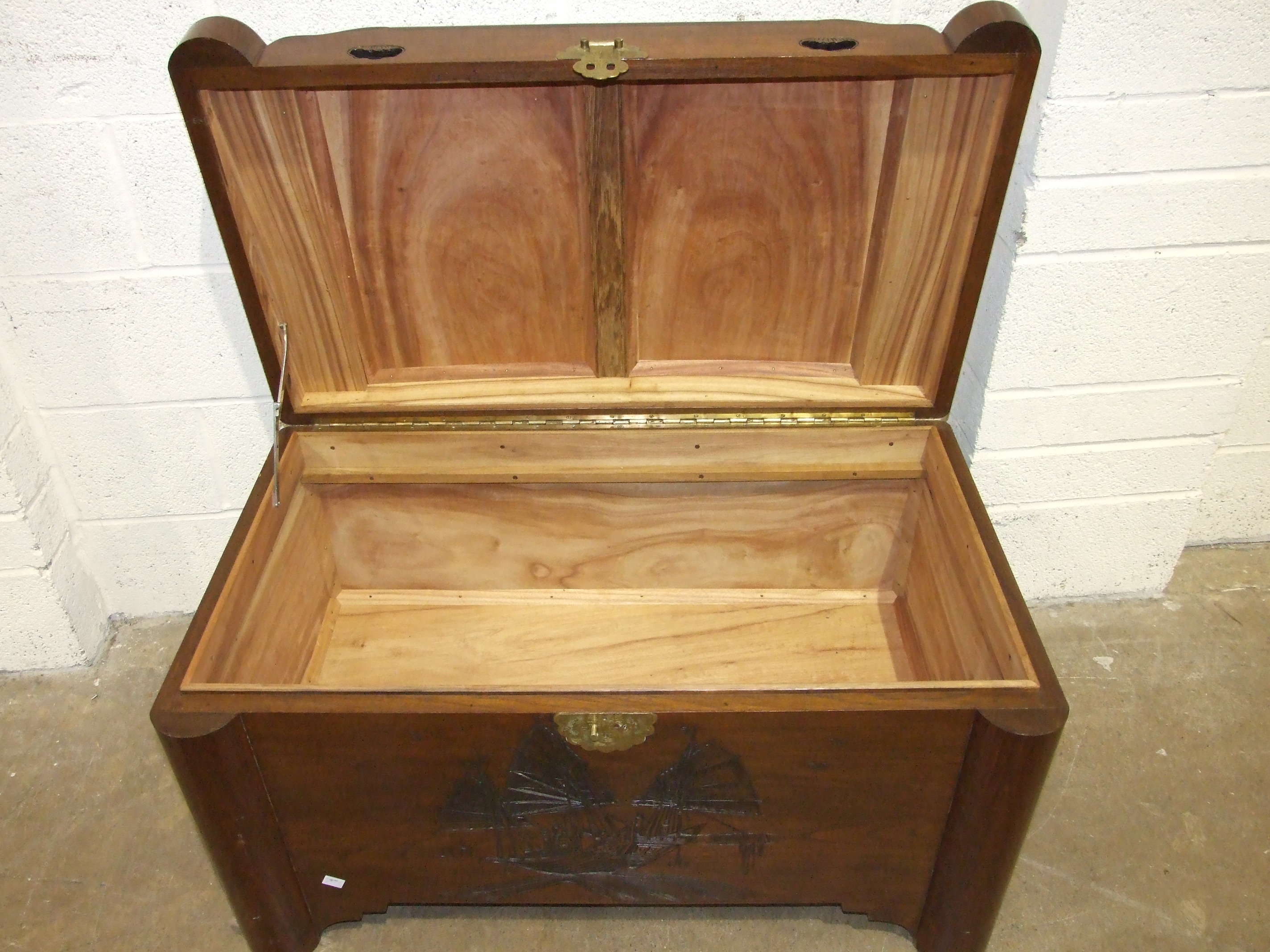 An Oriental hardwood camphor-wood-lined blanket box with carved "junks" decoration on front, 102cm - Image 2 of 4
