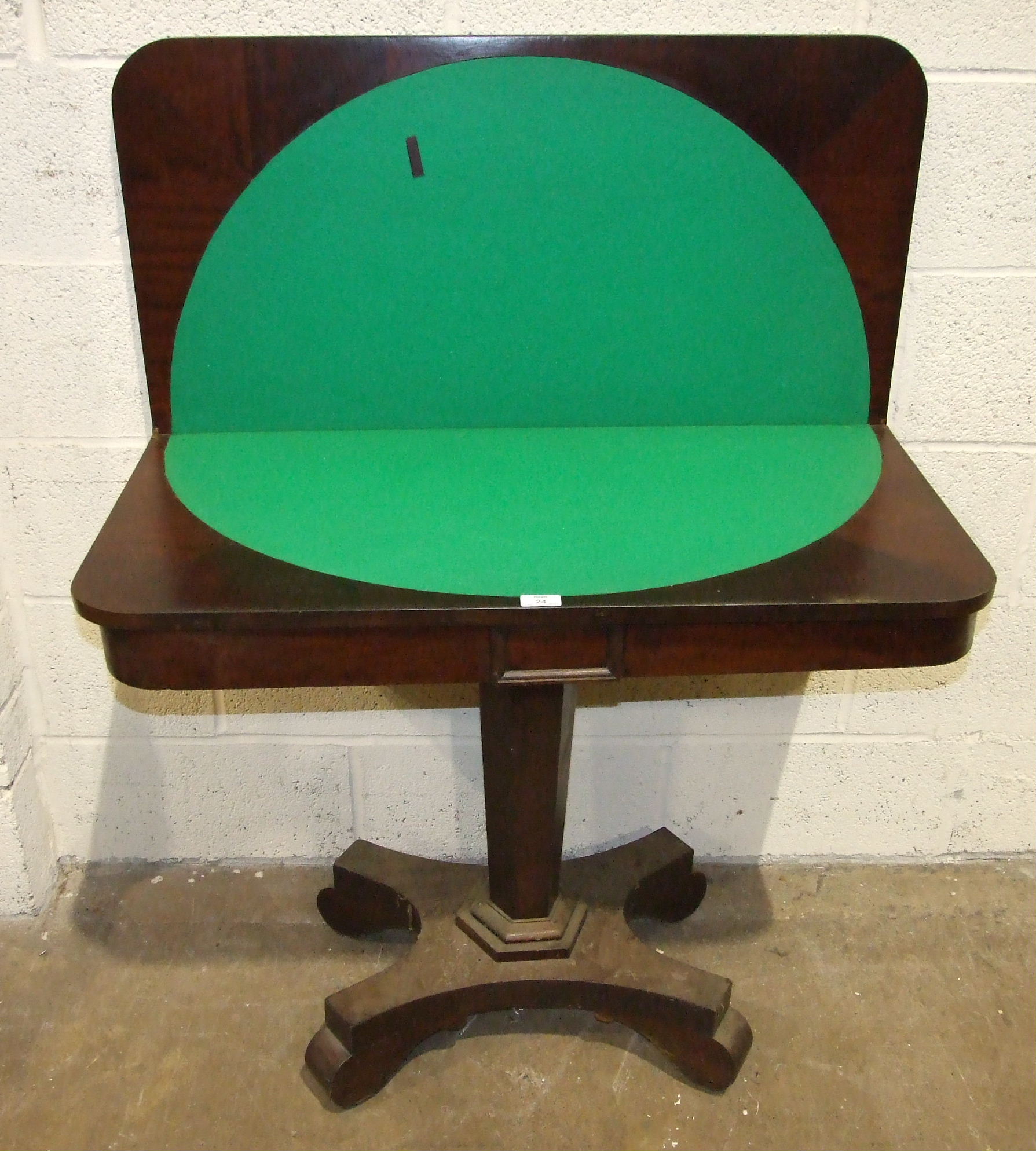 A Victorian mahogany fold-over card table, 91cm wide.