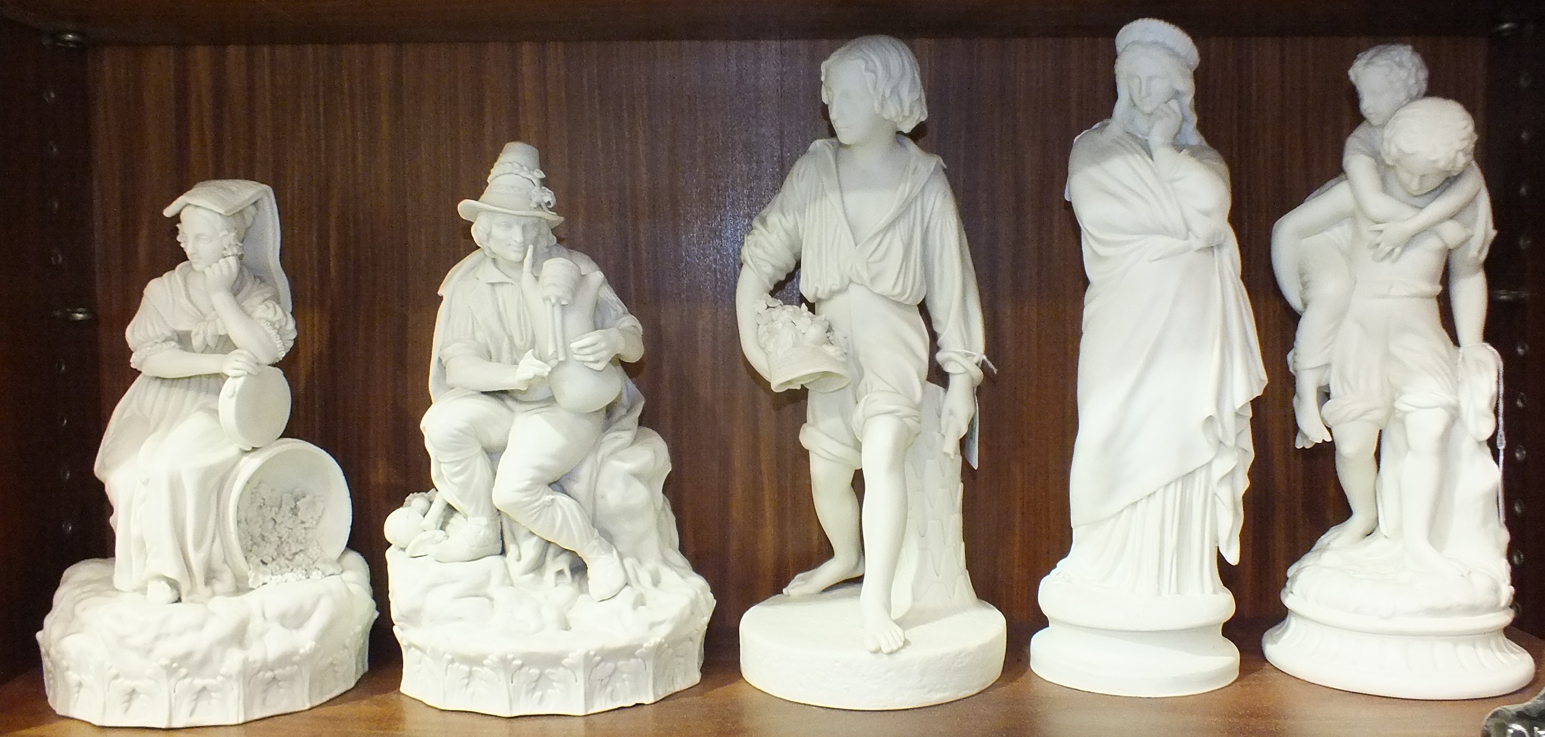 A pair of 19th century Continental parian ware figure groups depicting country figures, the female - Image 2 of 2