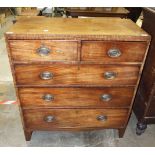 A late Georgian rectangular mahogany chest of two short and three long cock-beaded drawers on