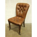 A reproduction leather upholstered and buttoned high back boardroom-style chair on carved front legs