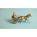 A silver miniature model of a jockey harness racing, 51mm long, marked Silver 900.