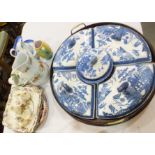 A 19th century blue and white willow pattern supper set, comprising four crescent shaped dishes