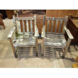 A pair of teak garden chairs with slatted backs and seats, both 59cm wide, (2).