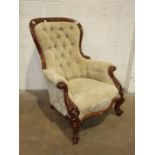 A mahogany button-back salon chair, the carved wood frame with serpentine seat on carved cabriole
