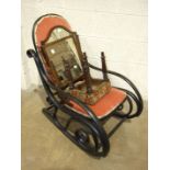 A stained bent wood rocking chair with padded seat and back, a shield-shaped dressing glass, 57cm