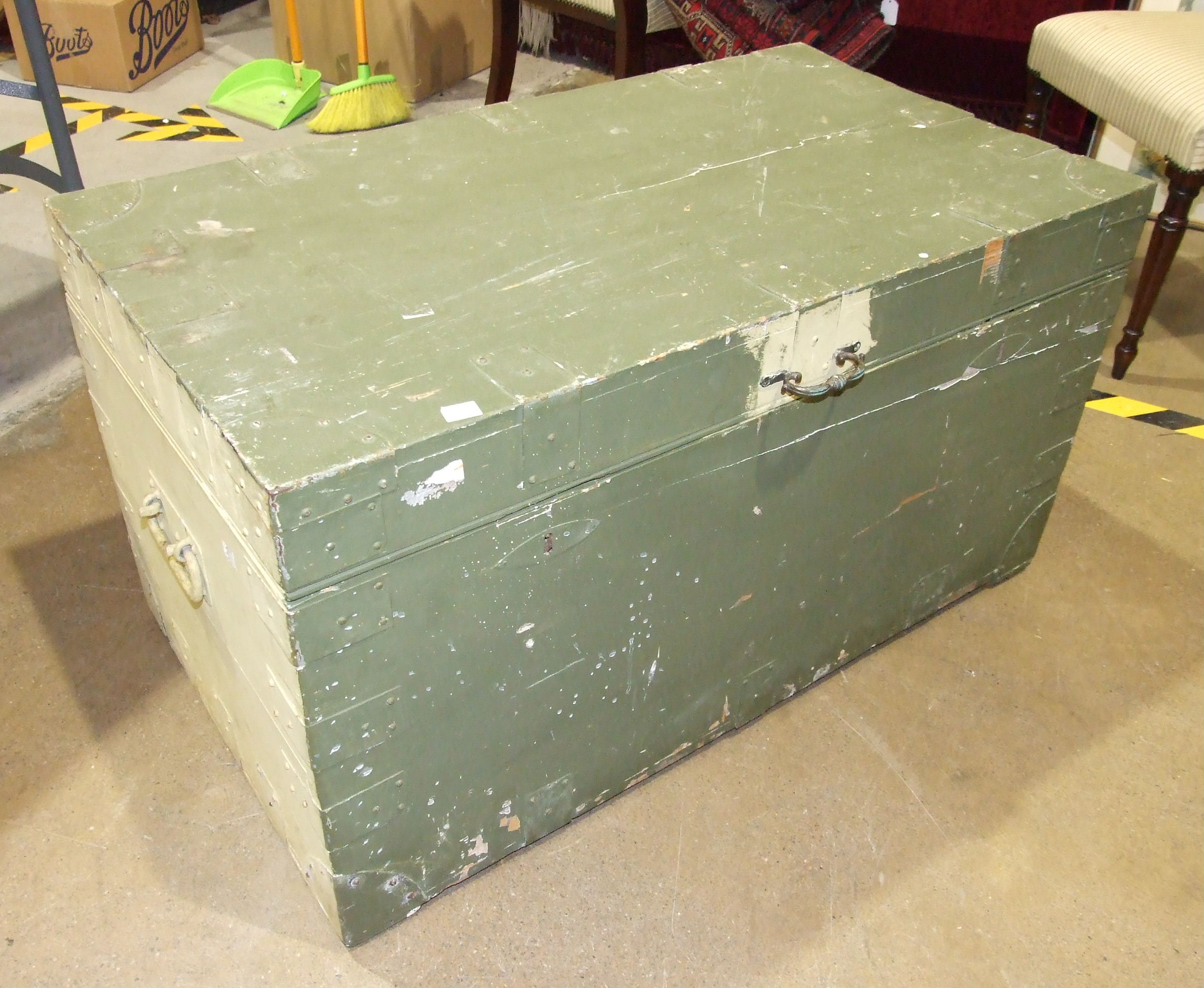 An early 20th century metal bound painted wooden chest with tin lining, 98cm wide, (split to lid).