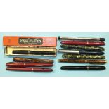 A Mabie Todd & Co Swan fountain pen, boxed, a Parker brown marble-effect fountain pen and nine