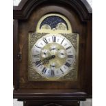 A modern mahogany-cased grandfather clock, having arched moon phase dial with day, month, date and