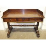 A Victorian mahogany washstand fitted with three small drawers on end supports joined by a pole