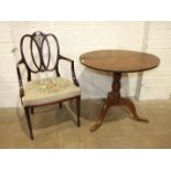 A Georgian oak tilt-top tripod table, 78cm diameter and a Hepplewhite-style mahogany carver chair,