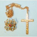 A 9ct gold cross on chain and a small 9ct gold openwork brooch, 4.1g.