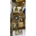 A pair of plated coasters, a pair of brass candle sticks, a door stop, a Gemstone egg box containing