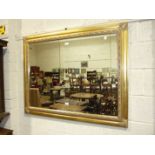 A modern gilt frame bevelled wall mirror, 93 x 119cm.