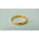 A 22ct gold wedding band, size K, 2.4g.