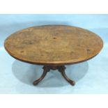 A Victorian walnut loo table, the top with moulded edge and boxwood inlay, on four turned columns