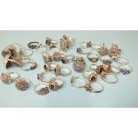 Forty silver rings, various designs, set marcasite with coloured stones, all marked Silver, gross