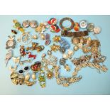 A quantity of figurative brooches and other costume jewellery.
