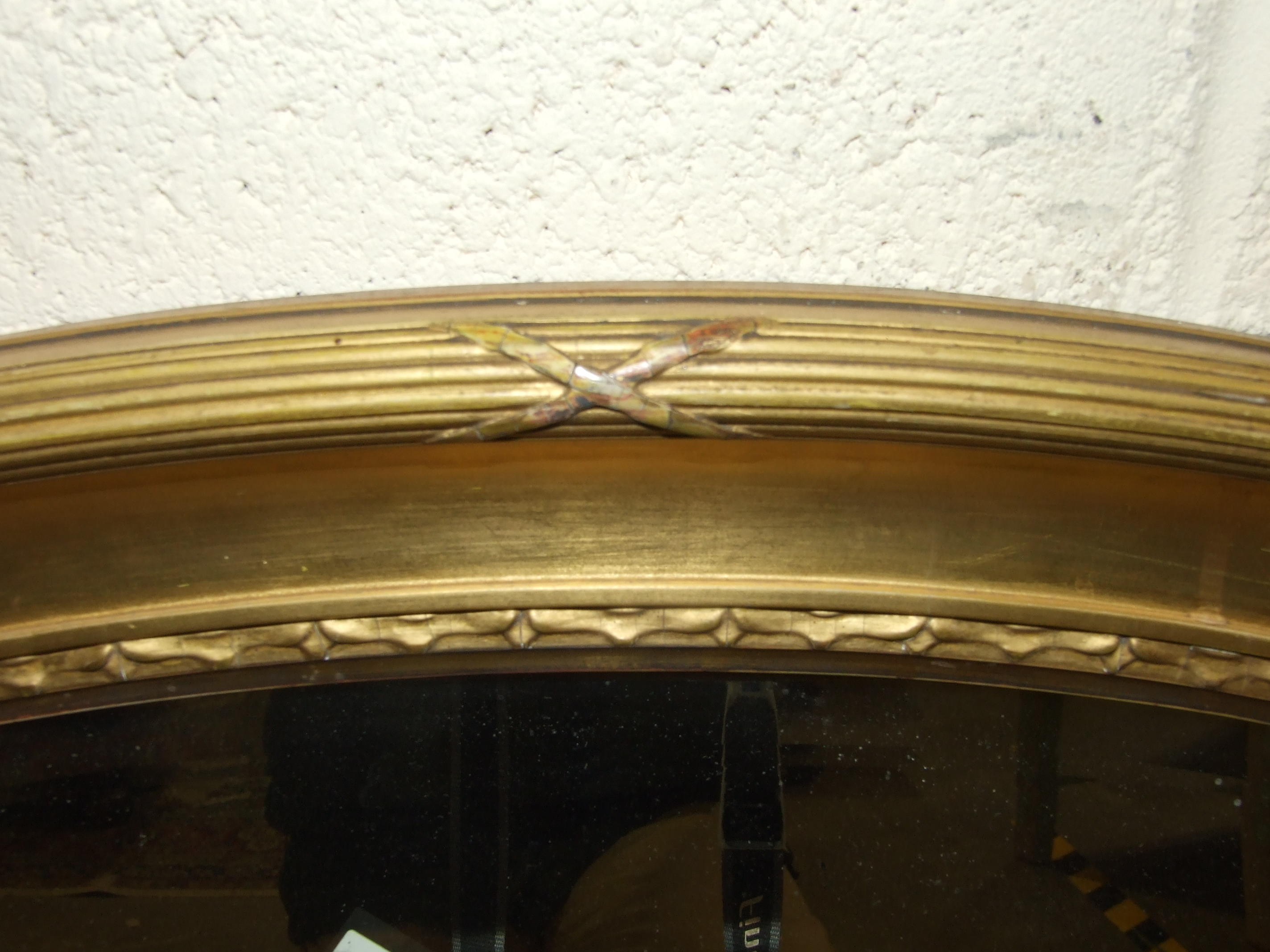 An oval gilt framed bevelled wall mirror, 73 x 100cm. - Image 2 of 2