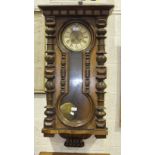 A walnut cased Vienna style wall clock, 100cm high.
