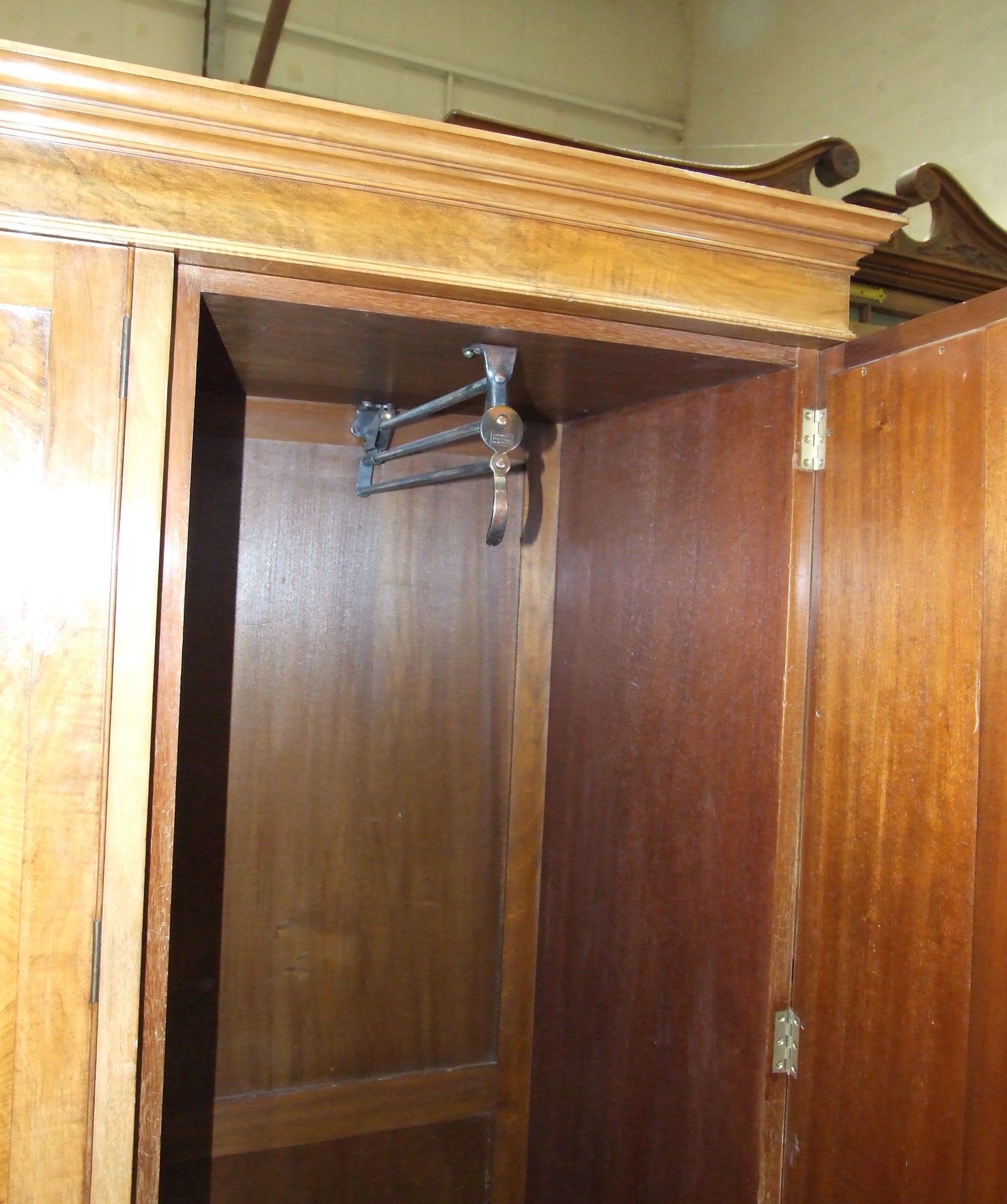 A Heal & Son Ltd walnut sectional wardrobe with central shelves and drawers flanked by mirrored - Image 4 of 4