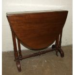 A Victorian mahogany drop-leaf oval table on turned end supports united by a pole stretcher, 106 x
