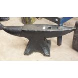 A large iron anvil, 81cm wide, 30cm high, an iron pump and a vintage mechanical hoe, (3).