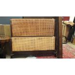 A 4' 6'' mahogany Bergère bed and side rail, with double-caned foot and single-caned head boards, (