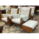 A 1970's G-Plan 'Saddle' three-piece hardwood and upholstered suite, short legs added to, with
