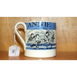 A 19th century Staffordshire mocha ware mug decorated with children playing and with the name 'Annie
