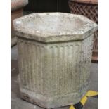 Three chimney pots, 90cm high, (damages) and an octagonal reconstituted stone planter, 42cm high,