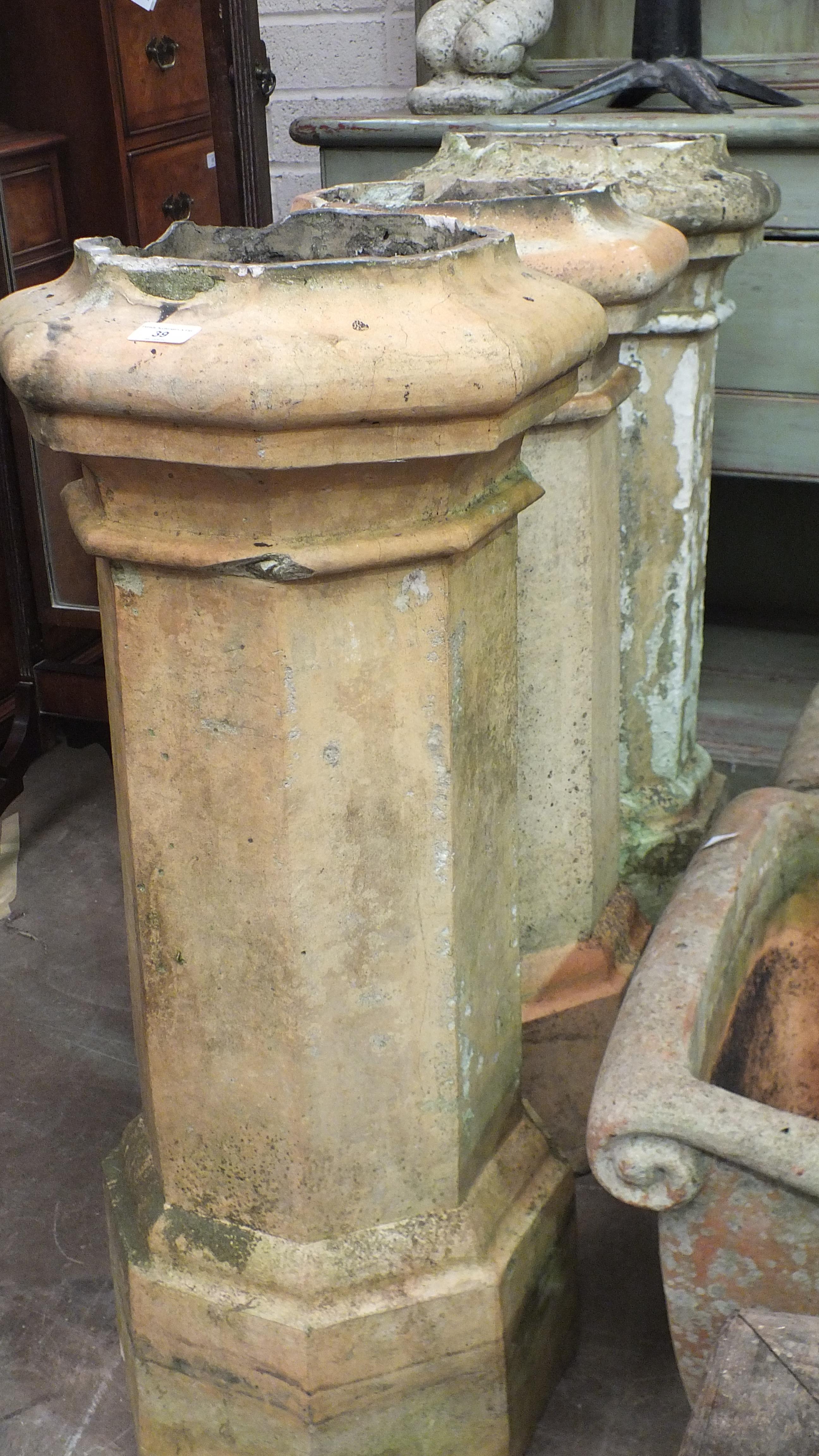 Three chimney pots, 90cm high, (damages) and an octagonal reconstituted stone planter, 42cm high, - Image 2 of 2