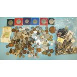 A collection of military badges, buttons and coinage, etc.