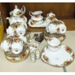 Forty-four pieces of Royal Albert 'Old Country Roses' teaware, two shoe ornaments, a porcelain-