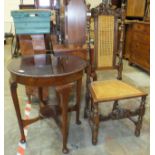 A circular mahogany occasional table on turned legs with pad feet united by an under-tier, 63cm