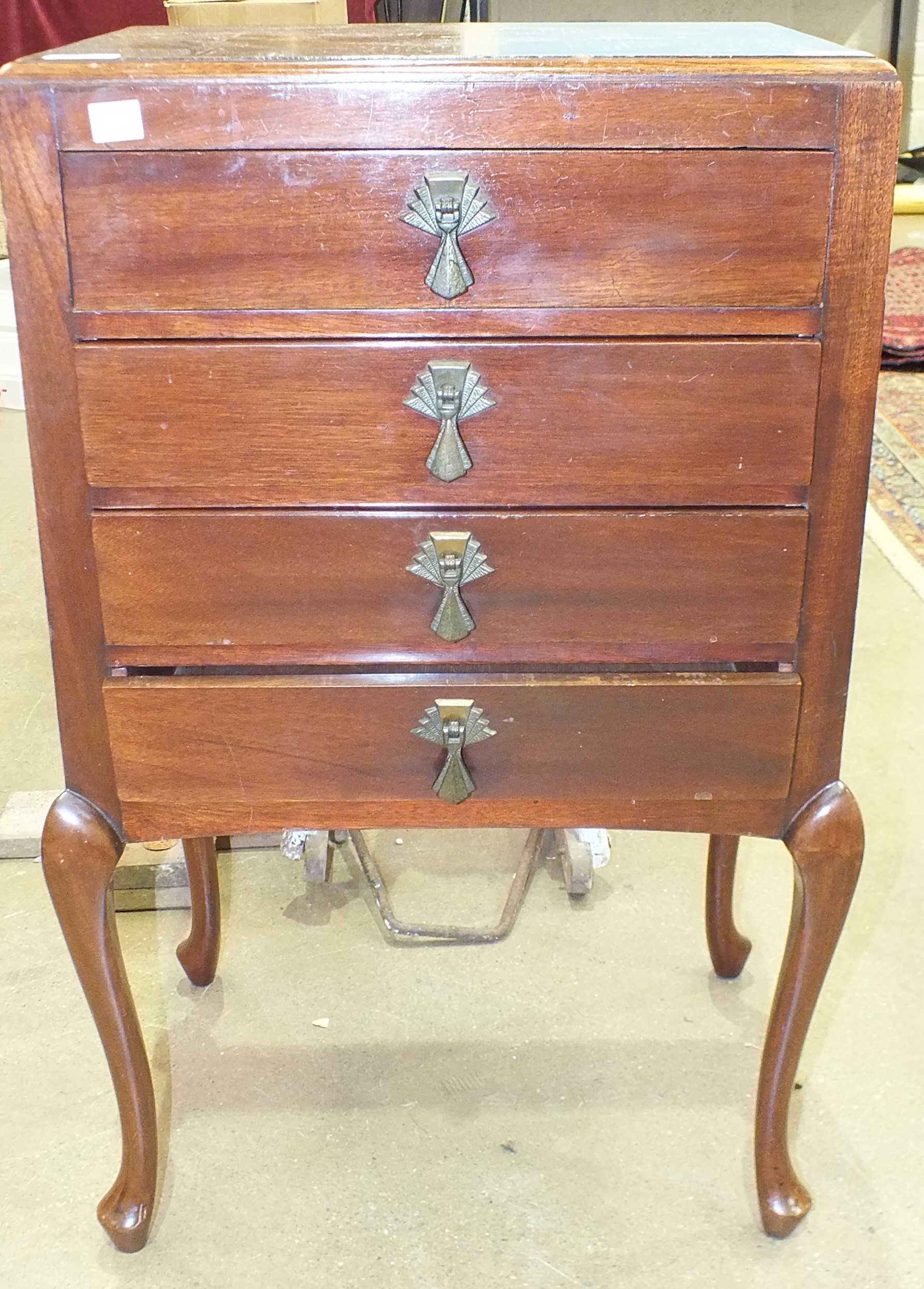 A mahogany music cabinet, having four drawers on cabriole legs, 48cm wide, 79cm high.