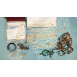 A quantity of cultured freshwater pearl jewellery, a tiger's eye bracelet and other jewellery.