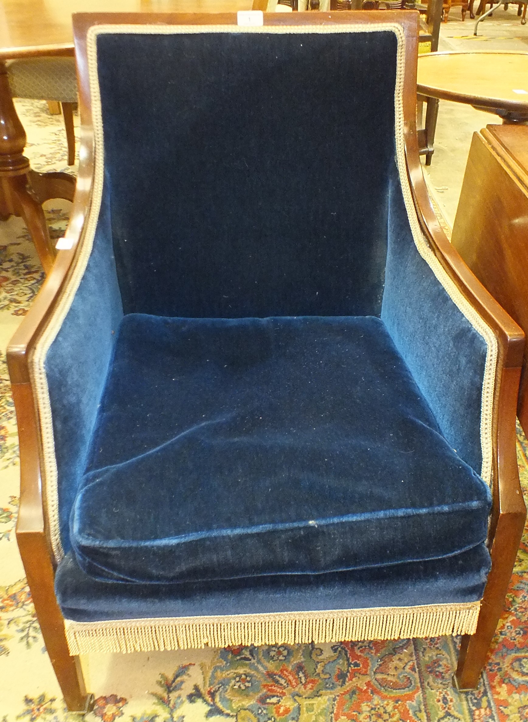 An Edwardian mahogany-framed upholstered salon chair with high back, on square tapered legs and a