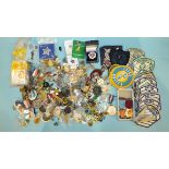 A collection of various badges and miscellaneous items.