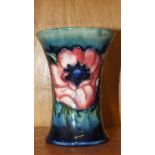 A Moorcroft vase of tapering form decorated with anemones on a mottled green ground, 10.5cm high,