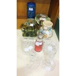 A cranberry glass sugar sifter, 15.5cm high, a green swirl glass vase, glass dressing table items