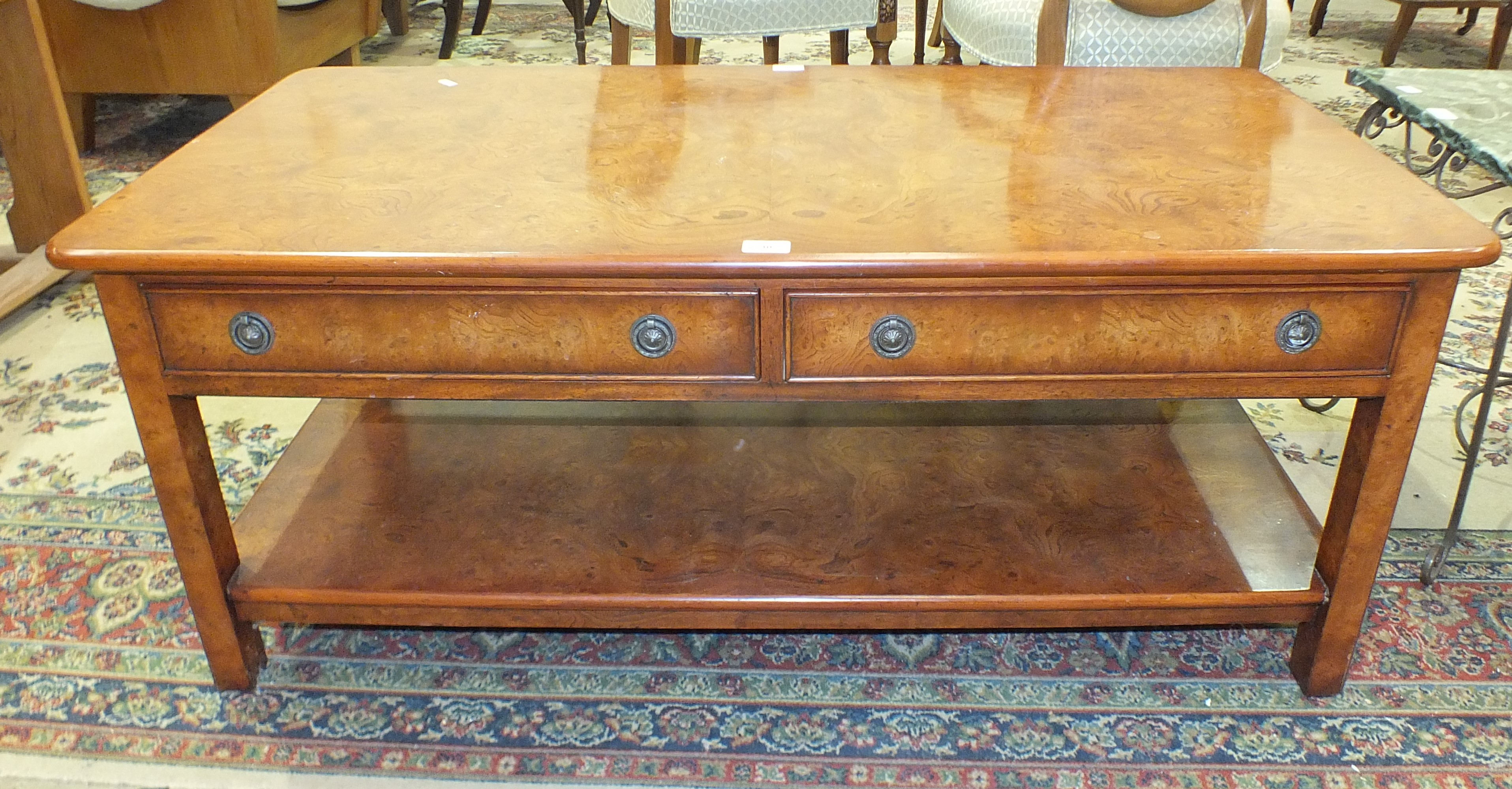 A modern walnut two-tier coffee table fitted with two frieze drawers, 122 x 61cm, 50cm high.