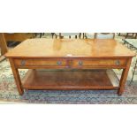 A modern walnut two-tier coffee table fitted with two frieze drawers, 122 x 61cm, 50cm high.