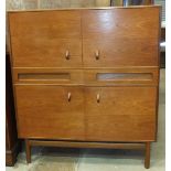 A 1960's A H McIntosh & Co. Ltd teak cupboard, having four cupboard doors separated by a pair of