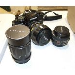 A Minolta x700 35m camera, a Soligor 1:3.5 telephone lens, a Minolta 50mm 1:1.7 lens and other