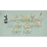 A collection of eleven Swarovski glass figures: sea lion balancing two balls, teddy bear, rocking