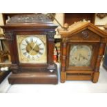 Two early-20th century oak-cased striking mantel clocks of architectural form, 38cm high and four