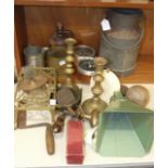 A brass trivet, a small brass sauce pan, a food knife and miscellaneous items.